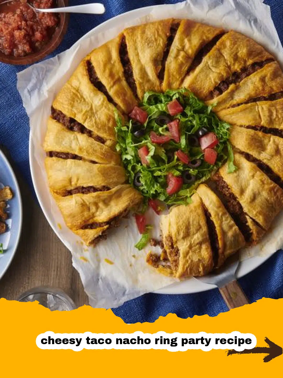 Delicious Cheesy Taco Nacho Ring Ready for a Party Golden brown cheesy taco nacho ring with seasoned ground beef and melted Mexican cheese, garnished with fresh cilantro, ready to be served