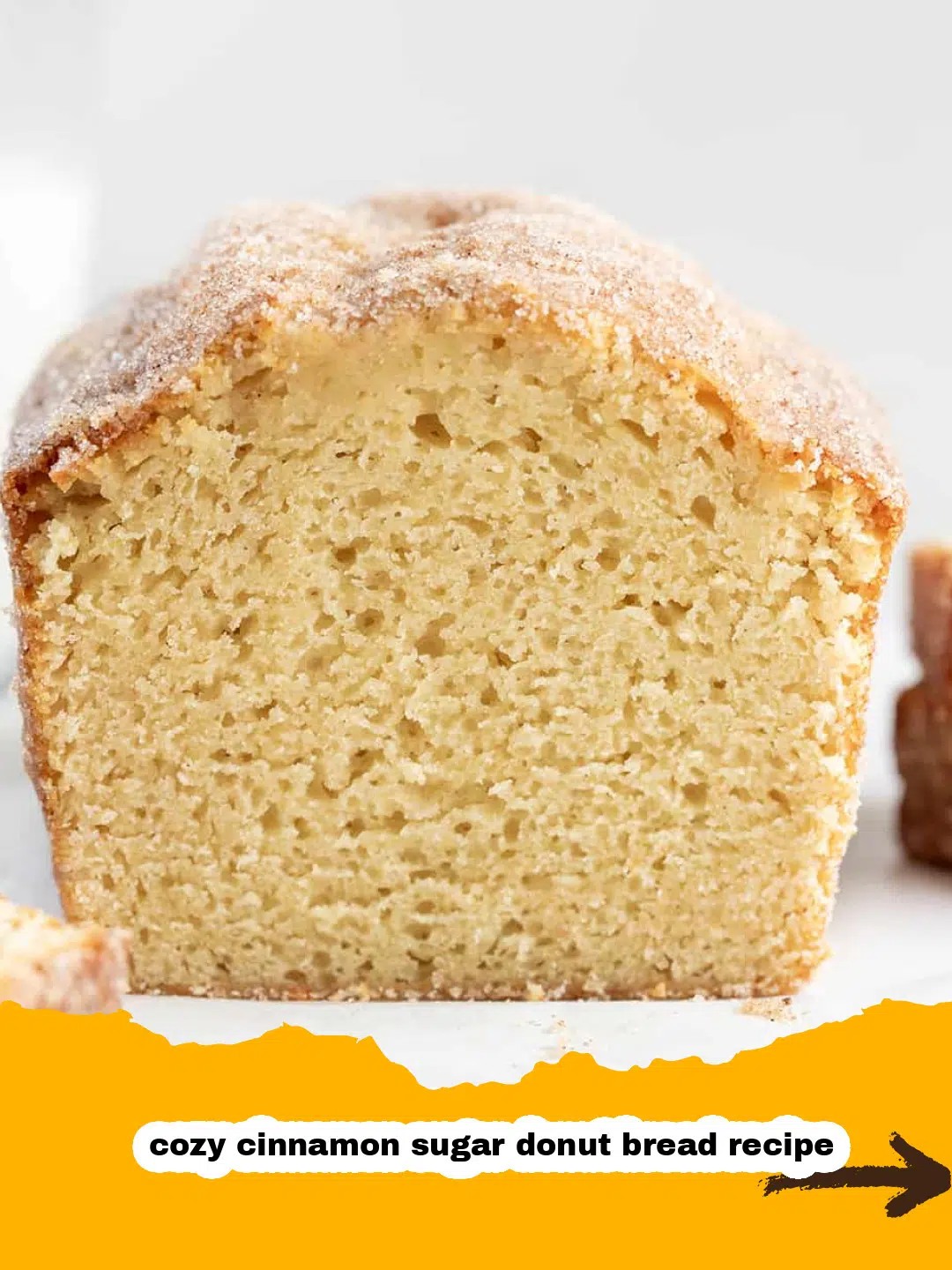 Homemade Cinnamon Sugar Donut Bread Freshly Baked Freshly baked cinnamon sugar donut bread cooling on a wire rack, dusted with sweet cinnamon sugar coating.
