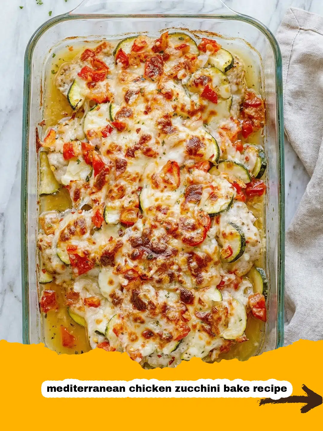 Mediterranean Chicken Zucchini Bake with Feta and Herbs Close-up of Mediterranean chicken zucchini bake ingredients prepped in a bowl with olive oil, herbs, and feta.