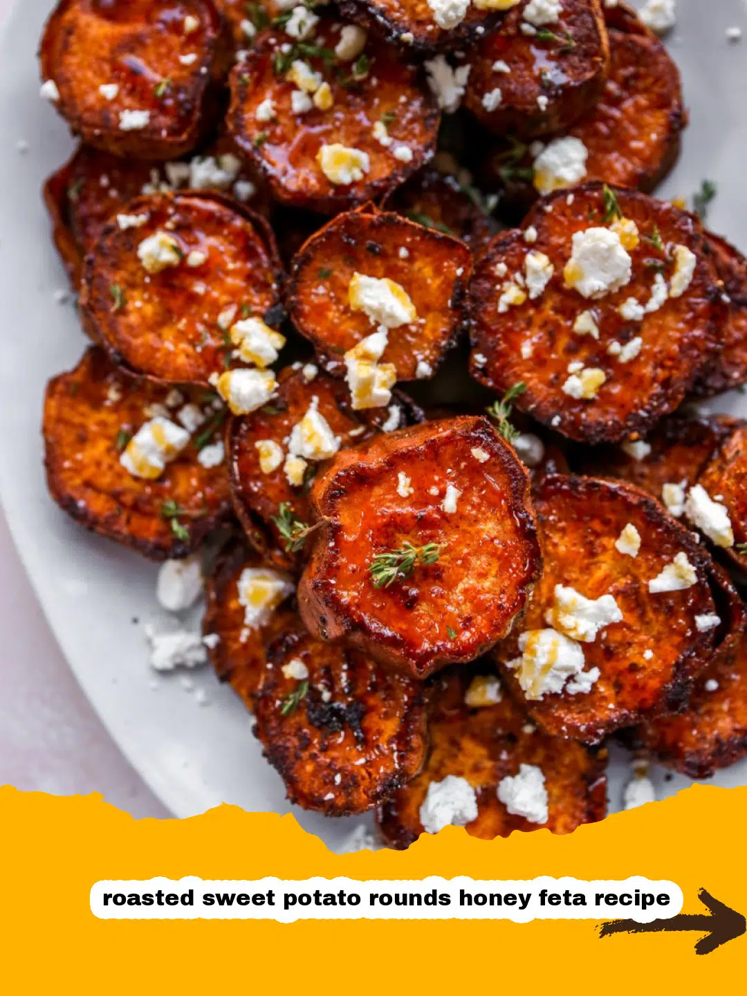 Honey Feta Roasted Sweet Potatoes Close-up of perfectly roasted sweet potato rounds drizzled with golden honey and crumbled feta cheese